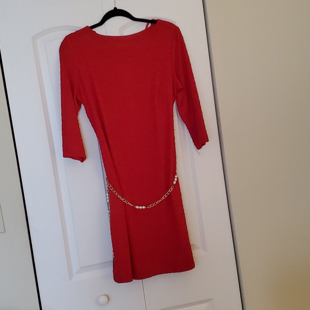 Stand out in the crowd with this bright red dress